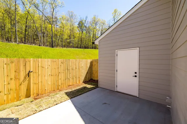 a view of a backyard of the house