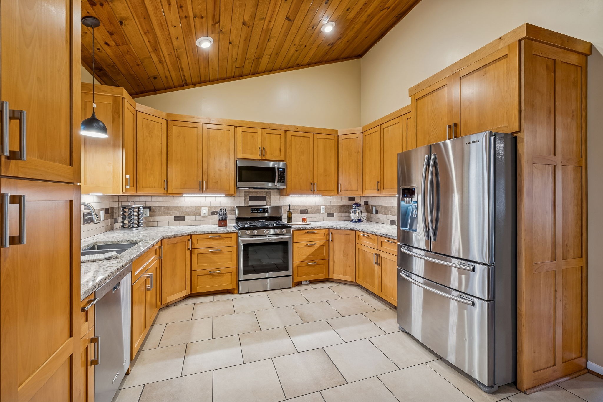 9200 Dobbs Cemetery Road Baxter, TN 38544 - Photo 25 of 85 a kitchen with stainless steel appliances granite countertop a refrigerator sink and stove