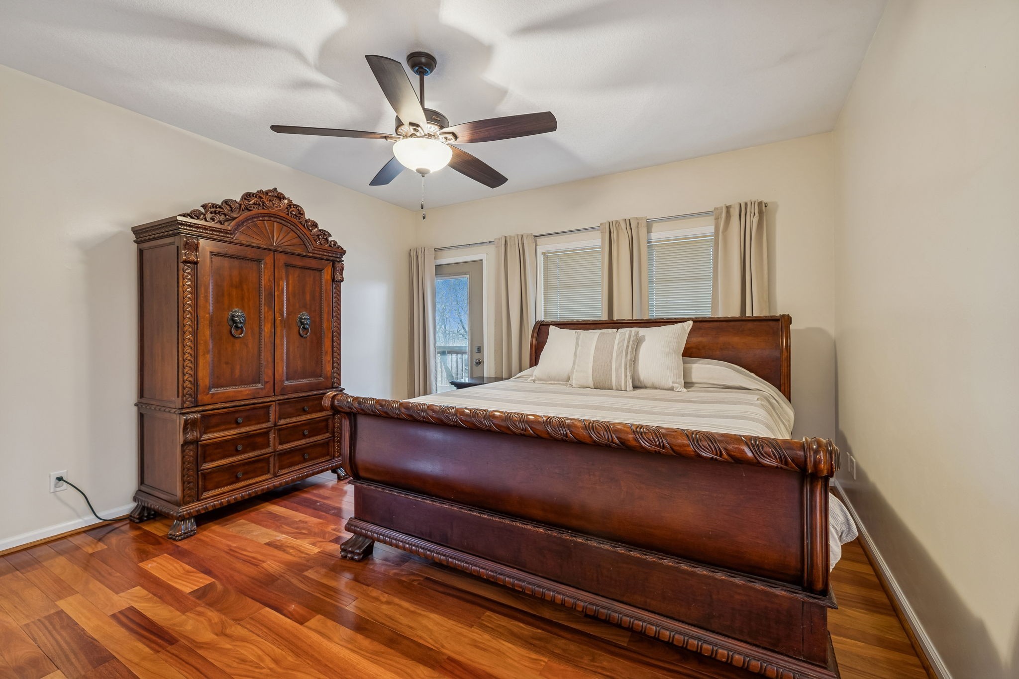 9200 Dobbs Cemetery Road Baxter, TN 38544 - Photo 29 of 85 a bedroom with a bed and a chandelier