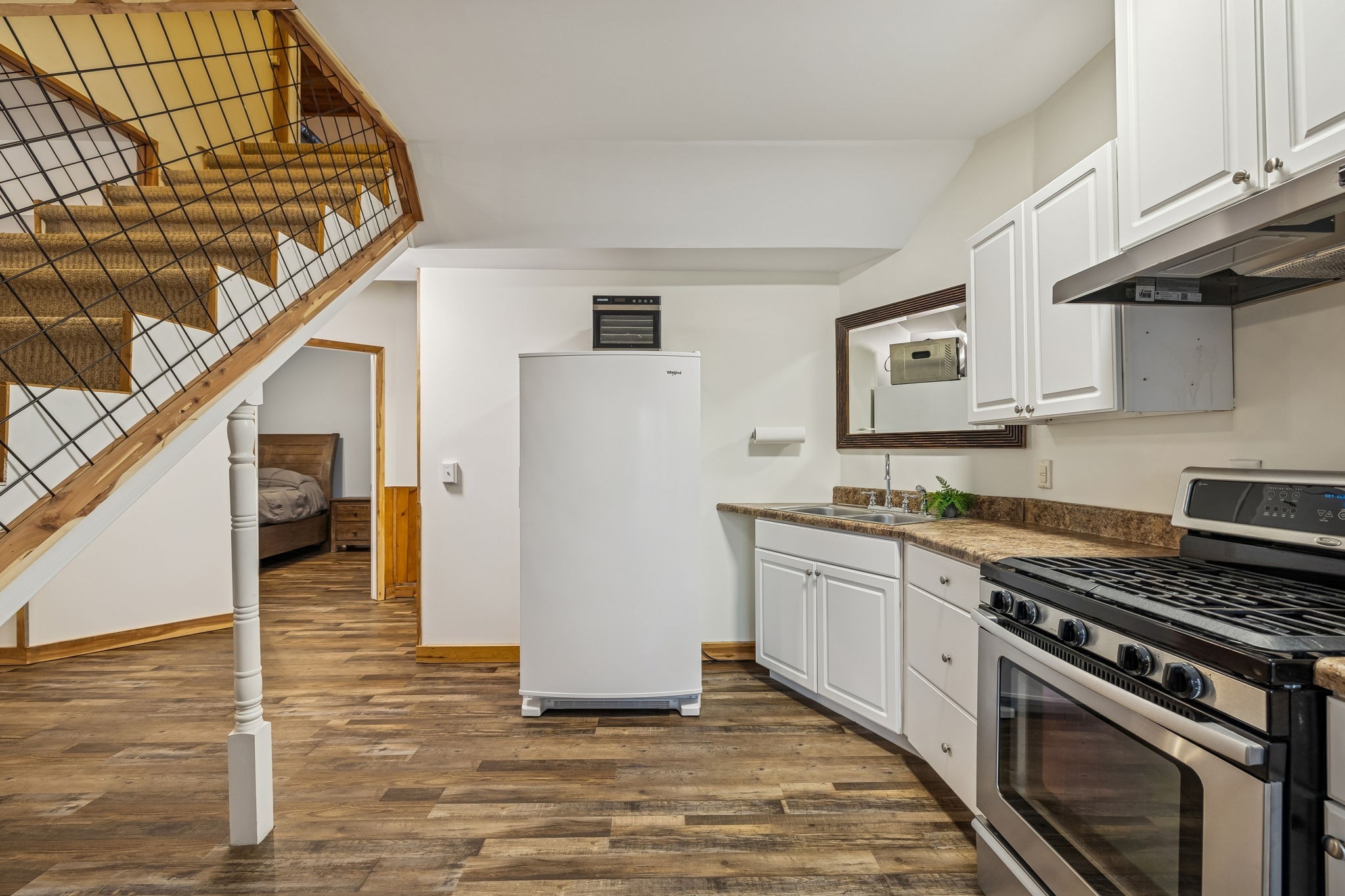 9200 Dobbs Cemetery Road Baxter, TN 38544 - Photo 45 of 85 a kitchen with granite countertop a stove and a refrigerator