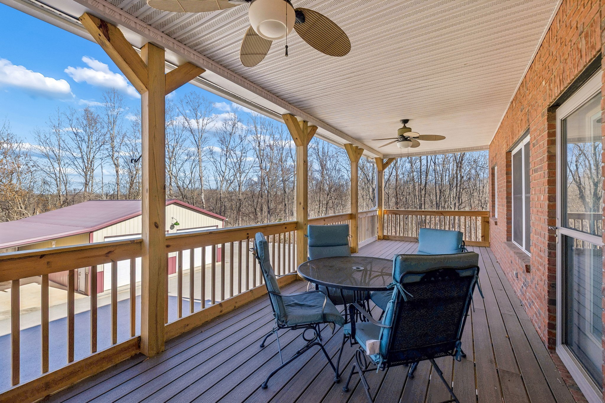 9200 Dobbs Cemetery Road Baxter, TN 38544 - Photo 64 of 85 a view of a dining room with furniture large windows and wooden floor