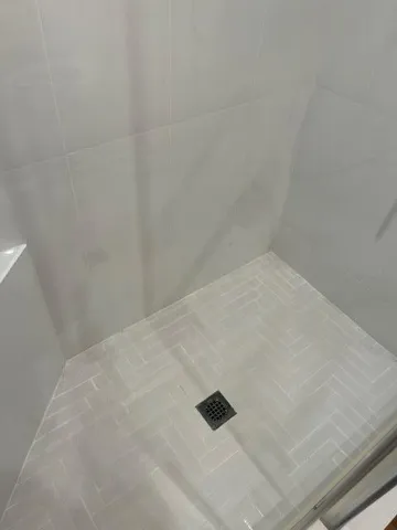 a view of kitchen with granite countertop cabinets and sink