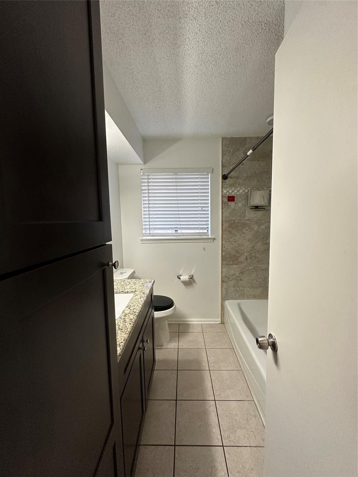 1410 Blalock Road, Unit 9 Houston, TX 77055 - Photo 12 of 18 a hallway with a wooden cabinets