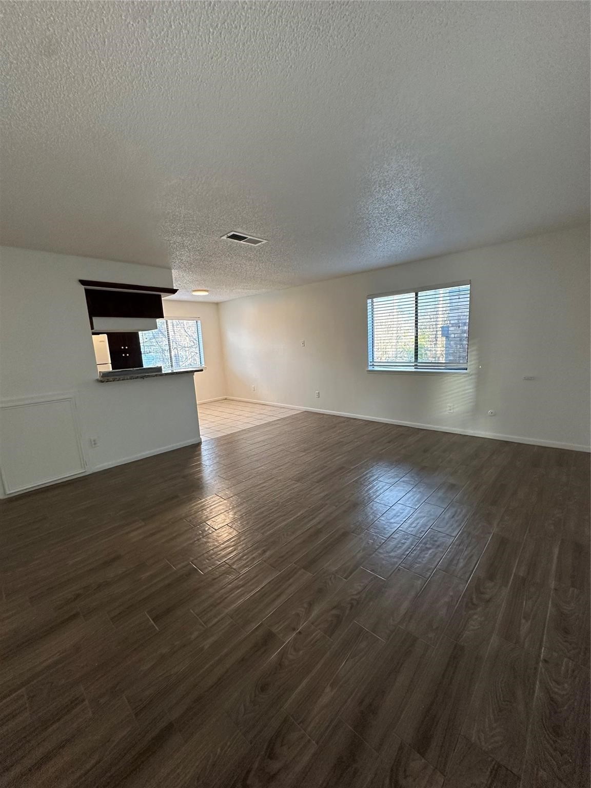 1410 Blalock Road, Unit 9 Houston, TX 77055 - Photo 8 of 18 a view of an empty room with wooden floor and a window