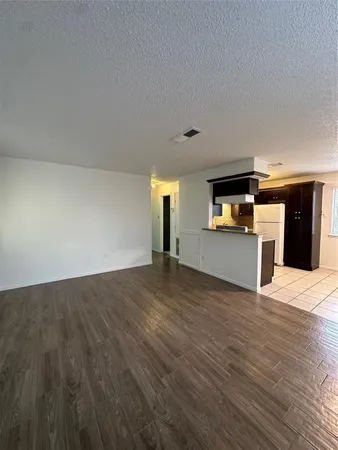 a view of a kitchen with a sink and a stove top oven