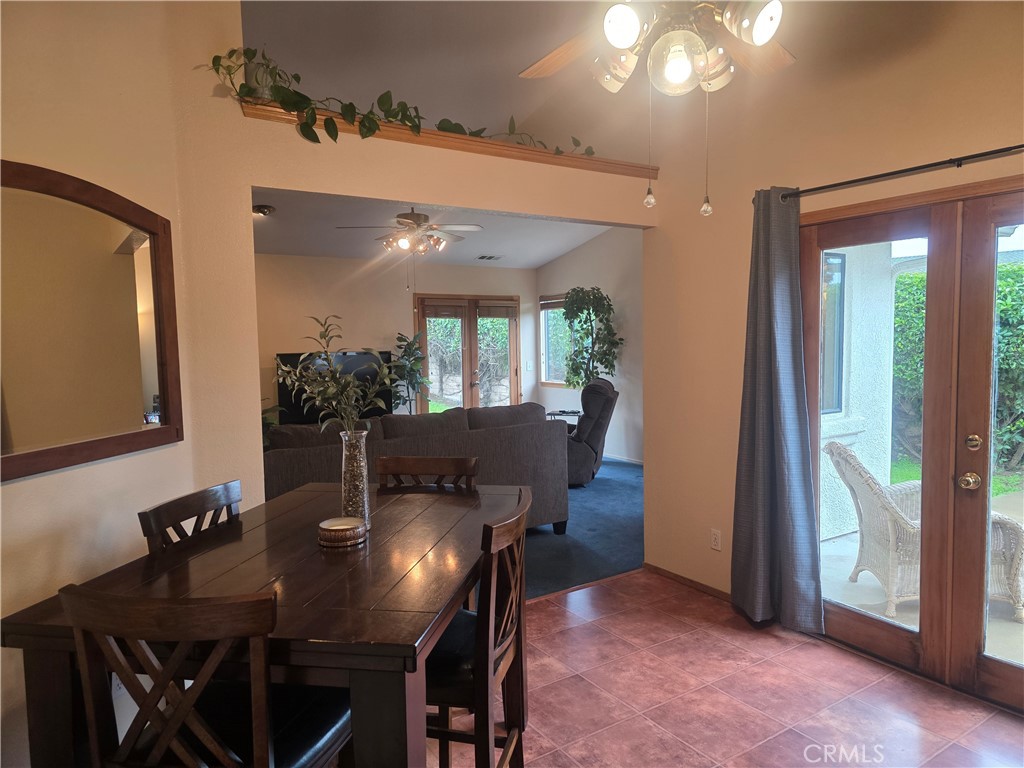 1618 Charlie Lane Santa Maria, CA 93454 - Photo 12 of 57 a view of a dining room with furniture and a potted plant