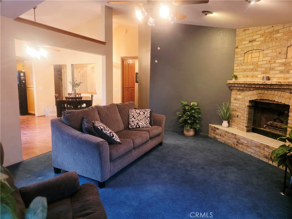 1618 Charlie Lane Santa Maria, CA 93454 - Photo 50 of 57 a living room with furniture and a fireplace