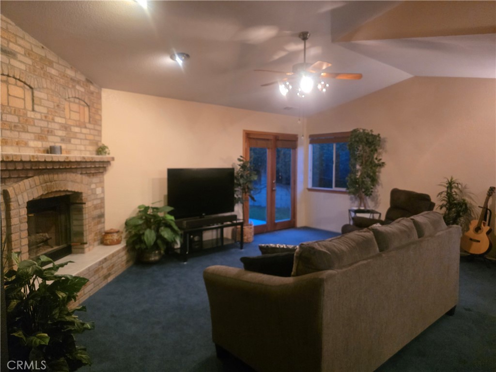 1618 Charlie Lane Santa Maria, CA 93454 - Photo 51 of 57 a living room with furniture and a flat screen tv