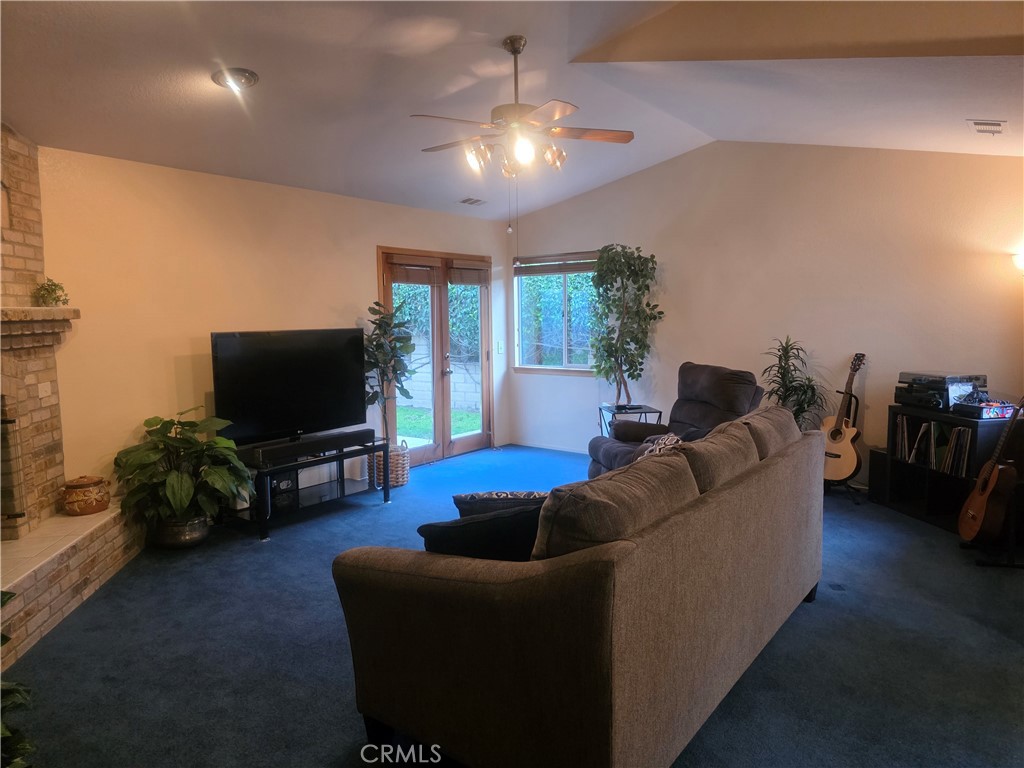 1618 Charlie Lane Santa Maria, CA 93454 - Photo 55 of 57 a living room with furniture and a flat screen tv