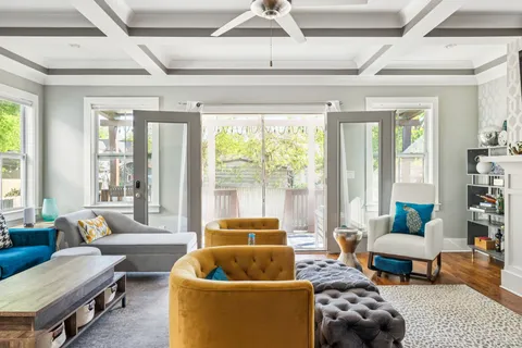 a living room with furniture and a large window