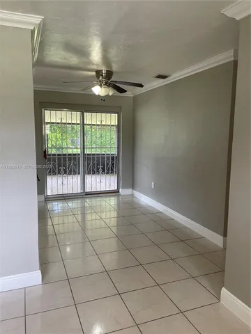 a view of an empty room with a glass door