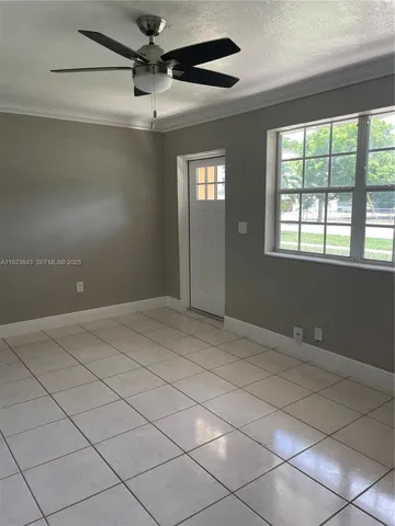 a view of an empty room and window