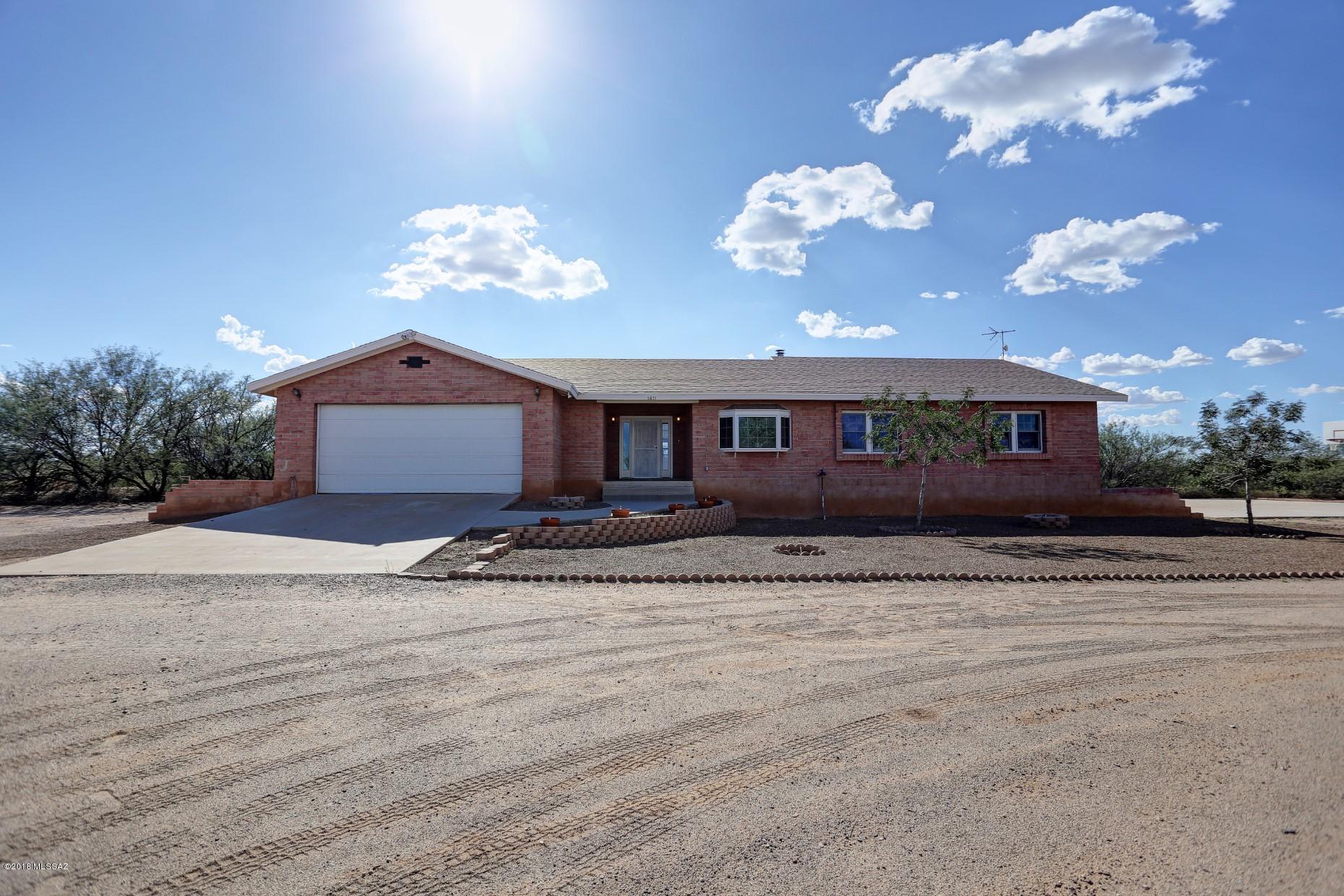 5851 South Avra Road Tucson, AZ 85735 - Photo 43 of 46 a view of a house with a yard