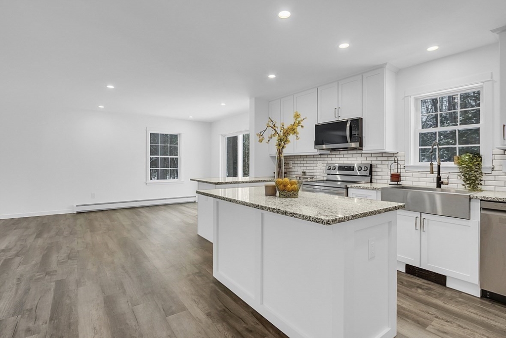 823 Carpenter Road Athol, MA 01331 - Photo 12 of 41 a kitchen with granite countertop a sink appliances and cabinets