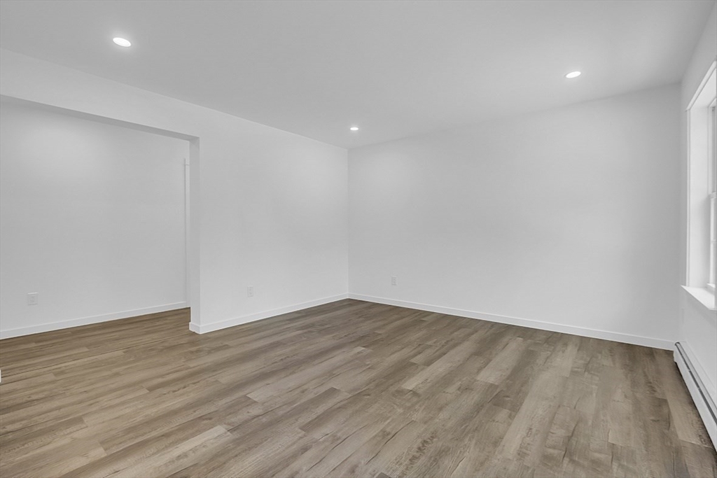 823 Carpenter Road Athol, MA 01331 - Photo 14 of 41 a view of an empty room with wooden floor and closet