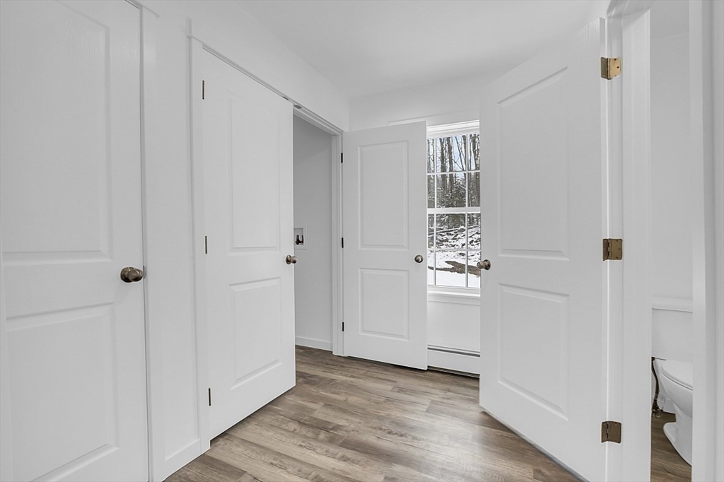 823 Carpenter Road Athol, MA 01331 - Photo 16 of 41 a view of a hallway with wooden floor and closet
