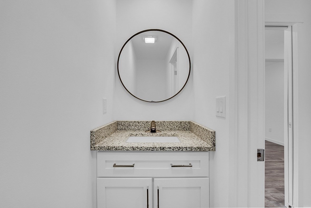 823 Carpenter Road Athol, MA 01331 - Photo 17 of 41 a bathroom with a granite countertop sink and a mirror