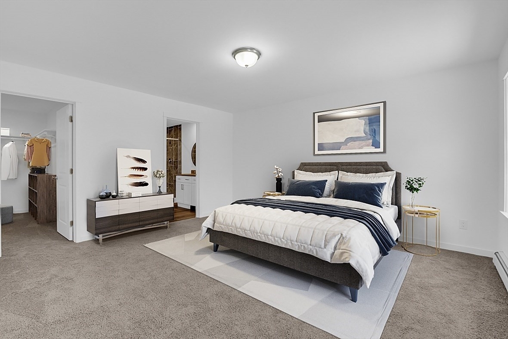 823 Carpenter Road Athol, MA 01331 - Photo 19 of 41 a spacious bedroom with a bed and a lamp
