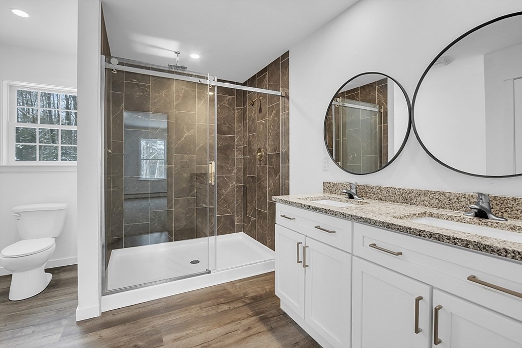 823 Carpenter Road Athol, MA 01331 - Photo 21 of 41 a bathroom with a double vanity sink toilet mirror and shower