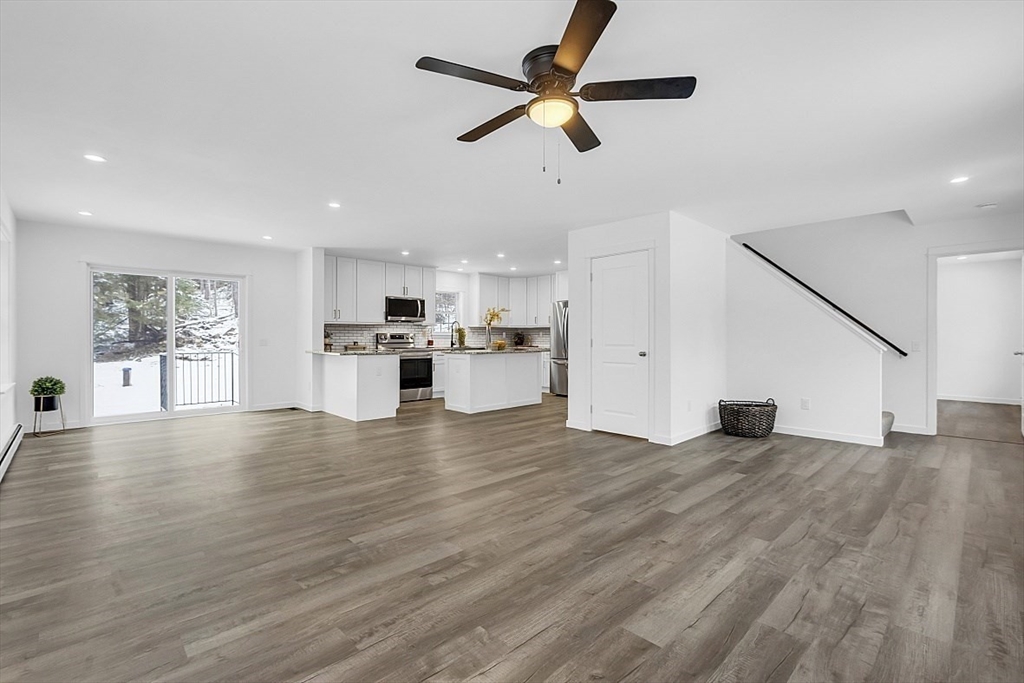 823 Carpenter Road Athol, MA 01331 - Photo 7 of 41 a view of empty room with wooden floor and window