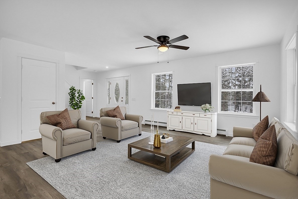 823 Carpenter Road Athol, MA 01331 - Photo 8 of 41 a living room with furniture a flat screen tv and a window