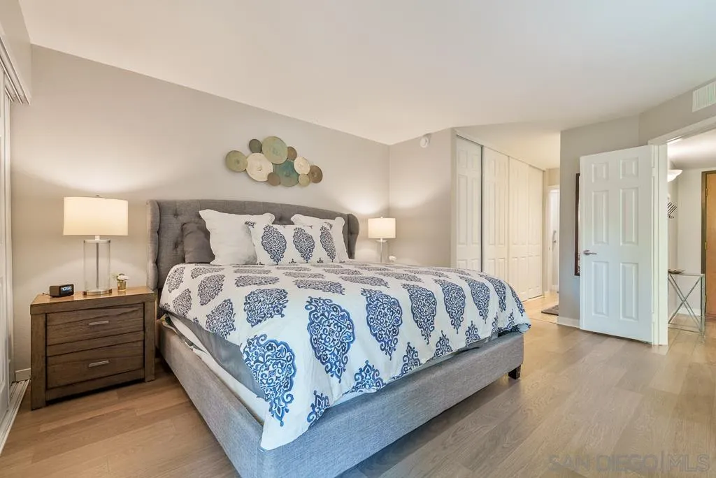 17637 Pomerado Road, Unit 123 San Diego, CA 92128 - Photo 16 of 61 a bedroom with a bed and a lamp