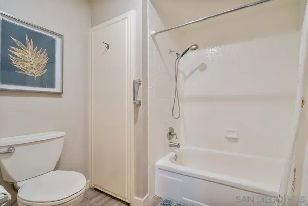 a bathroom with a tub and a shower