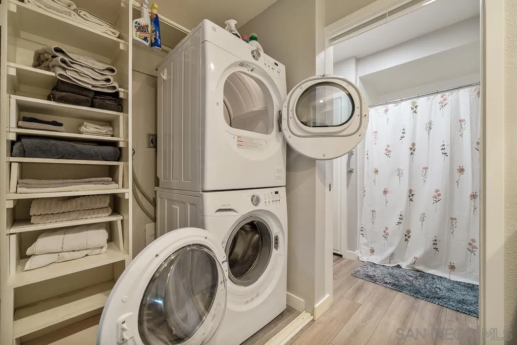 17637 Pomerado Road, Unit 123 San Diego, CA 92128 - Photo 25 of 61 a view of a hallway with washer and dryer