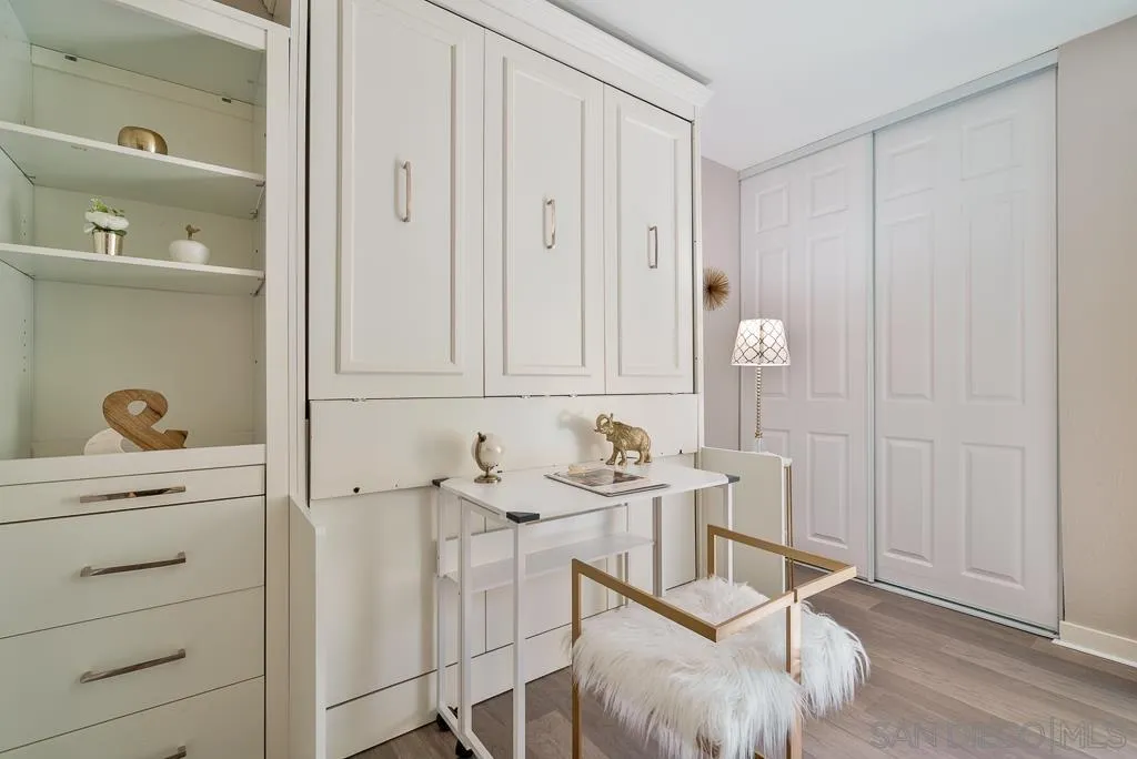 17637 Pomerado Road, Unit 123 San Diego, CA 92128 - Photo 27 of 61 a room with table chair and white cabinet