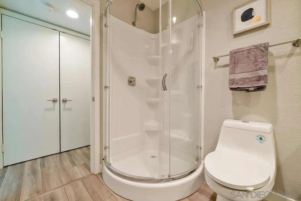 17637 Pomerado Road, Unit 123 San Diego, CA 92128 - Photo 29 of 61 a bathroom with a toilet and a shower