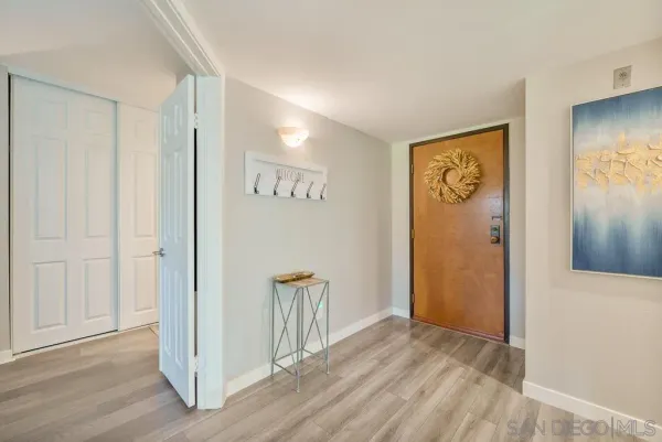 a view of an empty room and wooden floor