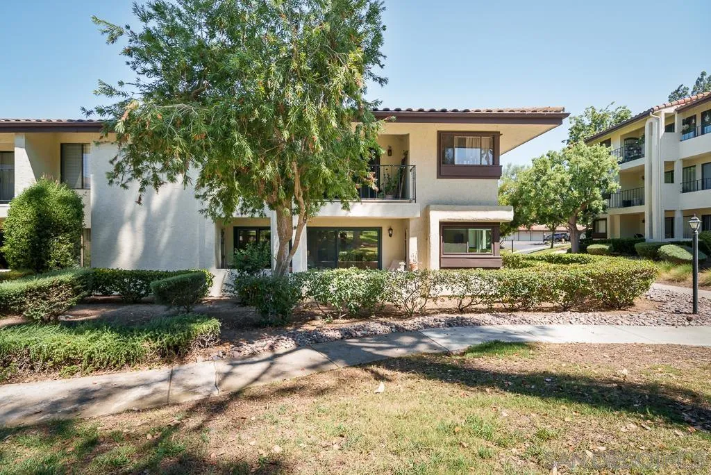17637 Pomerado Road, Unit 123 San Diego, CA 92128 - Photo 39 of 61 a front view of a house with garden and trees