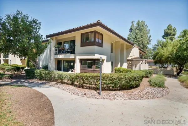 a front view of a house with a garage