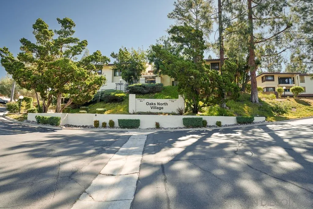 17637 Pomerado Road, Unit 123 San Diego, CA 92128 - Photo 41 of 61 a front view of a house with a yard and a tree