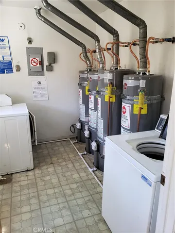 a view of storage and utility room with washer and dryer