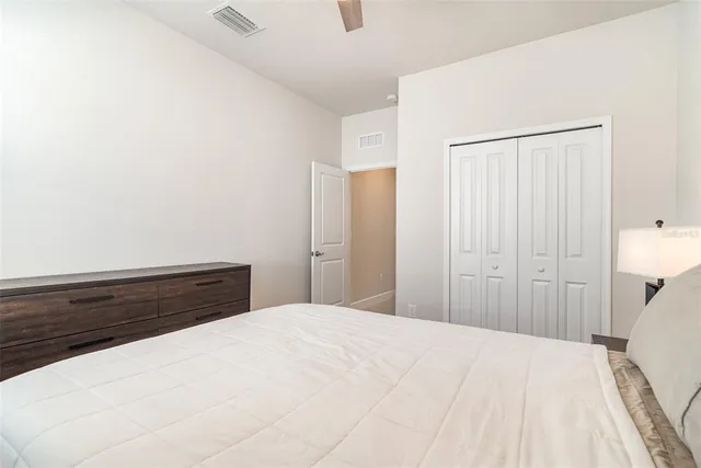 a bedroom with a bed and a cabinets