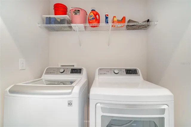 a utility room with dryer and washer