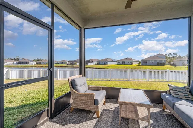 a view of swimming pool with outdoor seating