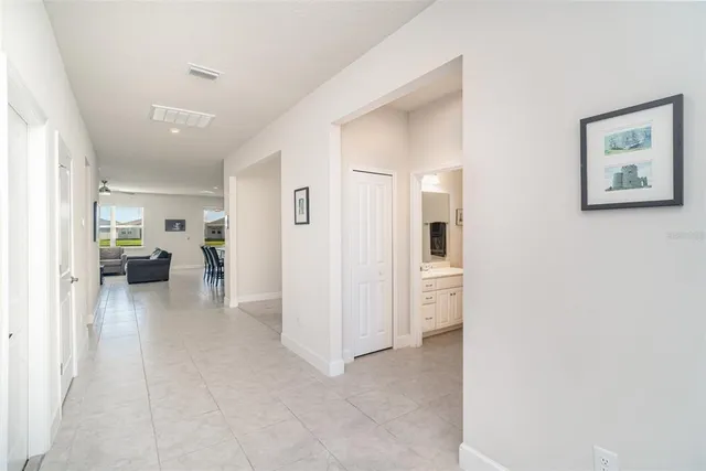 a view of a hallway with dining area and livingroom view