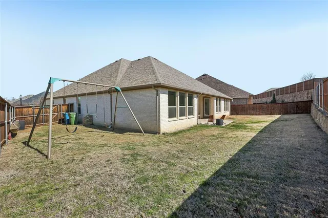 a house with trees in the background