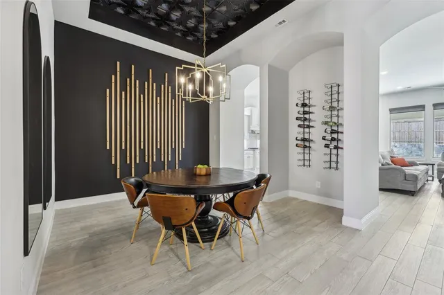 a view of a room with furniture and wooden floor