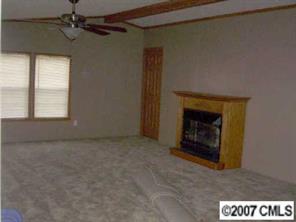2515 Hinson Road Monroe, NC 28112 - Photo 4 of 8 a view of empty room with a fireplace