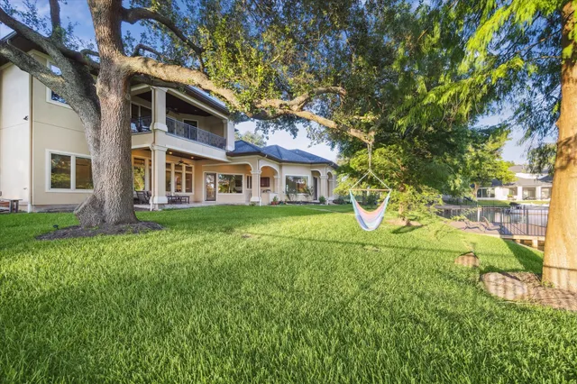 a view of a patio with table and chairs and potted plants