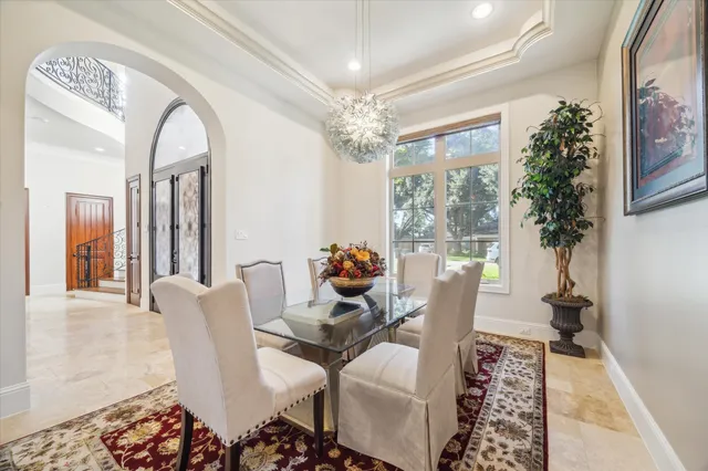 a view of a livingroom with furniture and a large window