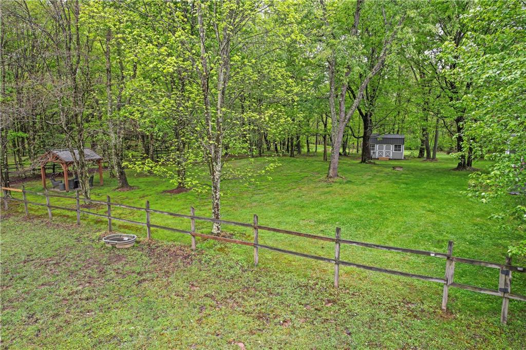 952 Bush Road New Alexandria, PA 15670 - Photo 12 of 50 Behind the house views of one of the pastures, as well as walk out to your private Pavilion/Gazebo to enjoy some serenity.