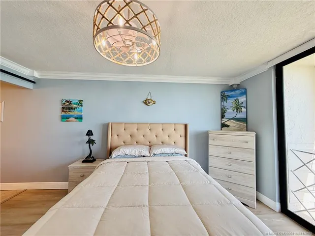a spacious bathroom with a sink and mirror