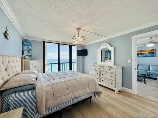 a bathroom with a granite countertop toilet sink and mirror