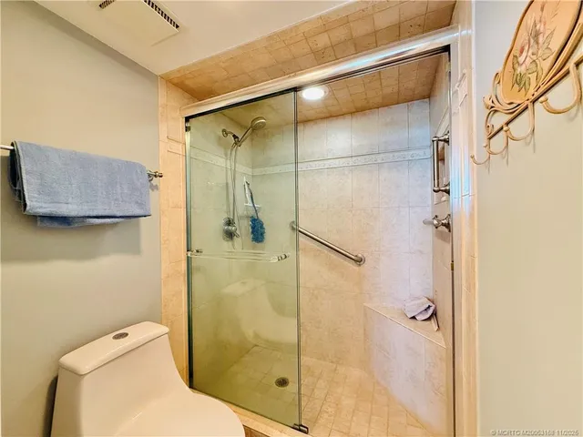 a kitchen with stainless steel appliances granite countertop a refrigerator a stove top oven a sink dishwasher and wooden cabinets