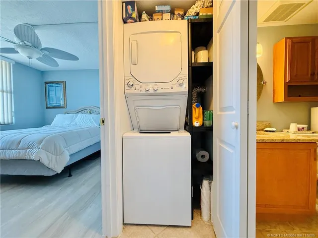 a view of a patio with dining table and chairs plants and garden