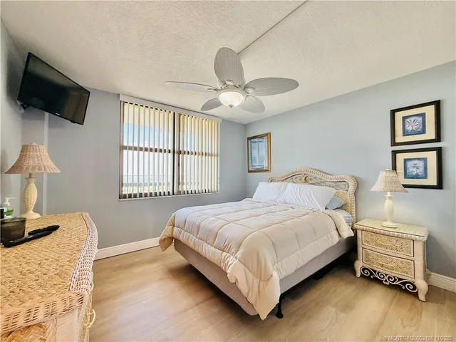 a view of a balcony with wooden floor
